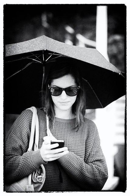 Girl in Rain with iPhone