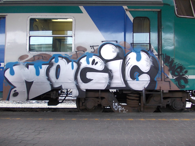 train car with graffiti that reads "magic"