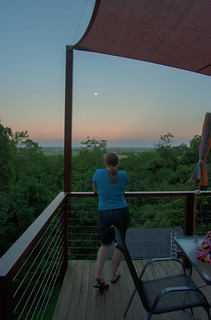 Heather watches the sunset as the moon rises