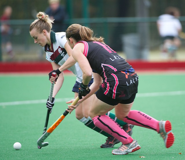 Vicky Bryant keeps the ball away from the stick of Lou Bevan