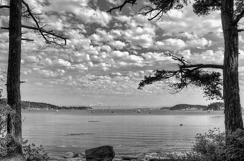 trees vacation blackandwhite water rock clouds bay nikon pacificnorthwest pugetsound sanjuanislands pnw tranquil suciaisland mountainrange echobay viewfromthewoodssuciaislandsanjuanislands