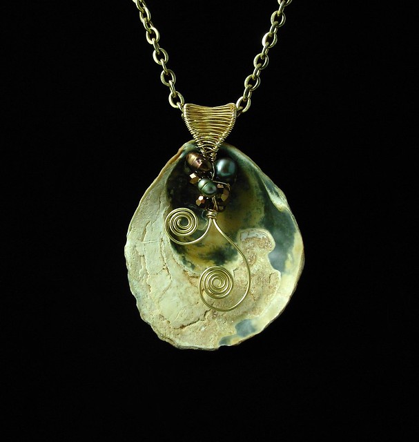 Shell pendant with pearls and brass (back)
