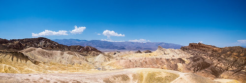 rock dry natural nature panorama vista national panoramic geology golden outdoors environment america stone landscape rugged mudstones canyon rocky intricate badlands wilderness clouds blue california zabriskie point view scenery vibrant travel scenic desert nationalpark colourful park usa ridge wide deathvalley