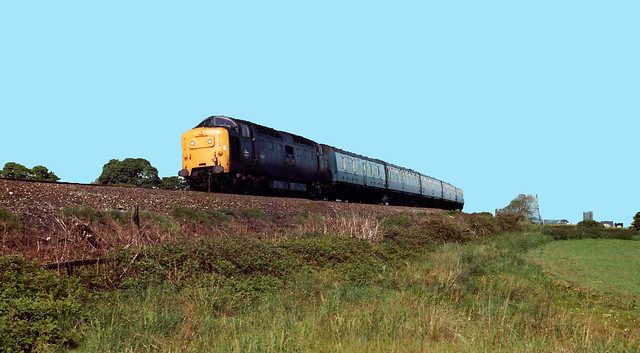 55014 Deltic approaches Cramlington on the ECML working the morning stopper service  1M04 from Edinburgh to Carlisle in the early 80’s.( This lovely view has now been replaced  with modern factory units)