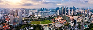 Flickr photo: Aerial view of the Singapore landmark financial business district at sunrise scene with skyscraper and over clouds. Panorama of Singapore downtown.