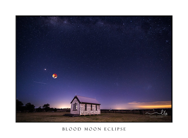 Blood moon  mars and starry sky over little timber church