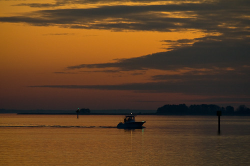sunset reflection night island lights bay boat cloudy maryland running chesapeake kentisland