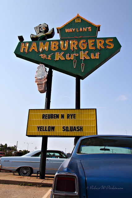 Waylan's Ku-Ku Hamburgers Sign with a Couple Classic Cars on Route 66 in Miami, Oklahoma