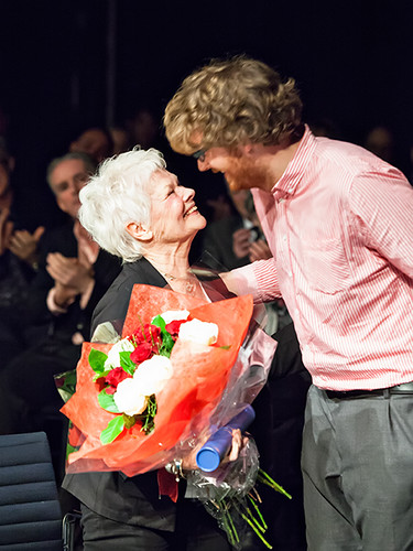 Central Student Union President Matt Withers presents Dame Judi Dench with flowers.