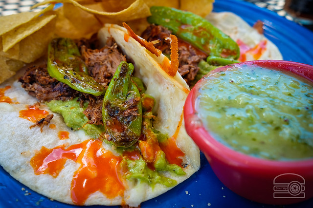 Lamb Tacos - Slow Beer Roasted Lamb Tossed in Chili Sauce, Jack Cheese, Guacamole, Grilled Shishito Peppers, Diced Onions, Cilantro, and Arbol Hot Sauce - Black Bear Burritos Evansdale