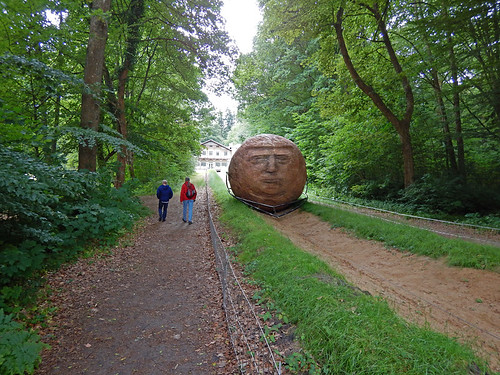 Sisyphus, a huge rolling stone sculpture that is periodically hauled up the hill at the Silkeborg Sculpture Garden in Denmark