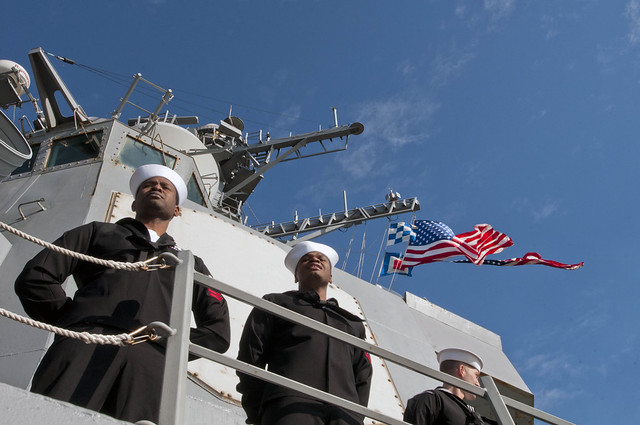 Sailors man the rails of USS Winston S. Churchill.