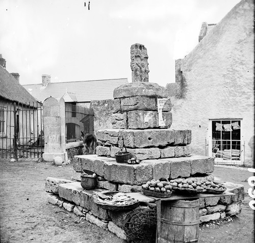 blackall mcdonagh blackallmcdonagh shops thatchedroof thatch donkey plinth stone carved jesus crucifixion auction posters baskets creels fish apples cloth material barrel cask stereoscopiccollection stereopairs stereographicnegatives stereoscope jamessimonton frederickhollandmares johnlawrence lawrencecollection 19thcentury athenry galway ireland connacht connaught burkeslane thesquare crossstreet bridgestreet marketsquare socketstone marketcross latemedievalgothiccross tabernacletype lanterntype stmaryschurch winemerchants spiritmerchants ironmongers hardware stationers grocers flourdealers gouldingsmanure guano nationallibraryofireland locationidentified