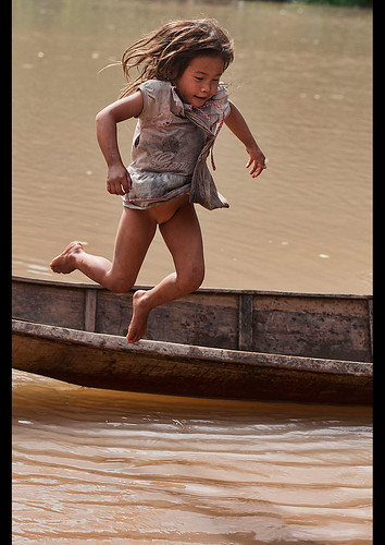 Lanten Girl Jumping Out Of Her Dugout Canoe On The Nam Ha … Flickr