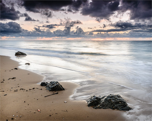 ocean beach sunrise sand rocks australia qld queensland stormclouds missionbeach bingilbay garnersbeach
