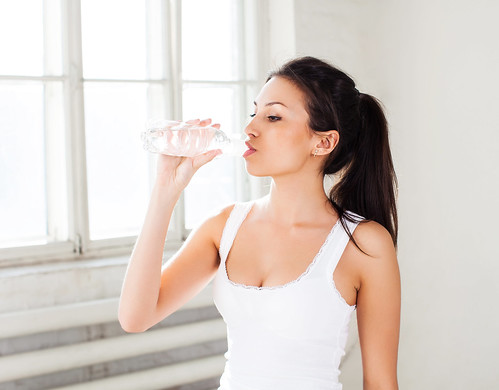 Fitness woman drink water