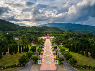 Aerial view of traditional thai architecture in the Lanna style , Royal Pavilion (Ho Kham Luang) at Royal Flora Expo, Chiang Mai, Thailand in sunset with blue sky and clouds.