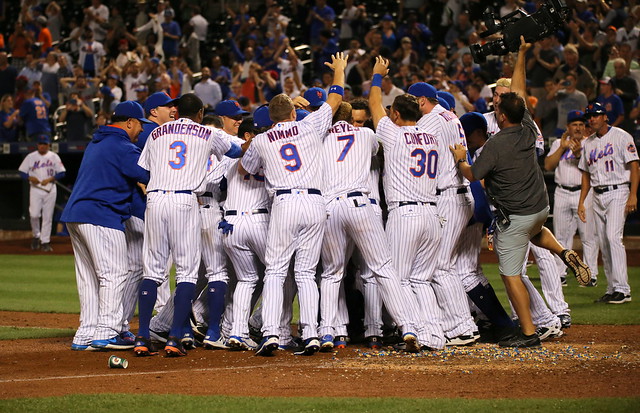 The Mets celebrate after their Amazin' walk-off win over the Phillies, 9-8.
