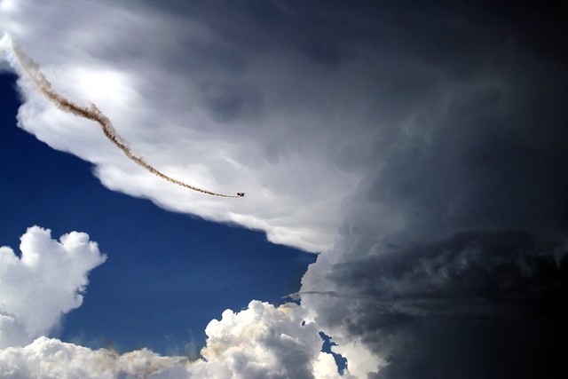 Pitts Special performing under massive anvil cloud