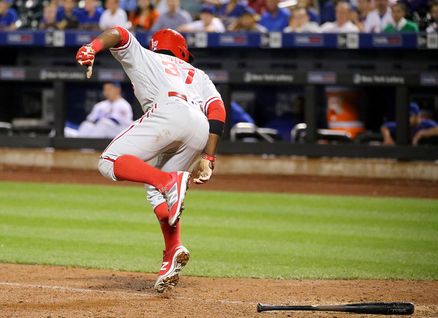 The Phillies' Odubel Herrera is hit by a pitch in the 11th inning.