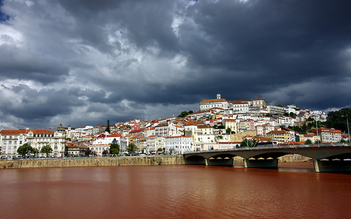 city trip travel bridge light red sky colour portugal water rain architecture clouds contrast river landscape photography europe university rooftops riverside camino hill sightseeing dramatic visit midday coimbra mondego riomondego pentaxk5ii pietkagab