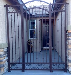 Arched Entryway with Forged Scrolls