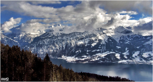 travel blue winter sky panorama lake snow mountains alps weather clouds forest canon landscape schweiz switzerland europe view lonelyplanet snowscape winterscape berneseoberland winterbeauty lakethun cantonberne thebeautyofnature