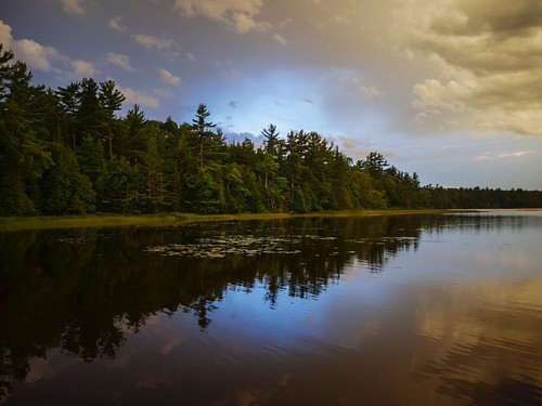 A welcome break in the angry clouds at Doyle Base Camp in Michigan's Upper Peninsula. #doylebasecamp #puremichigan #michigan #upperpeninsula #lakestella #puremittigan #sunset #sunsets #UP #vacation #d by cambolah, instagramapp square squareformat iphoneography uploaded:by=instagram