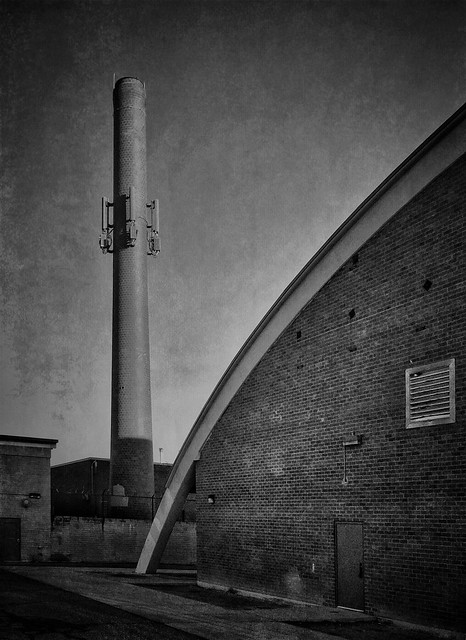 By the gym and the re-purposed smokestack...