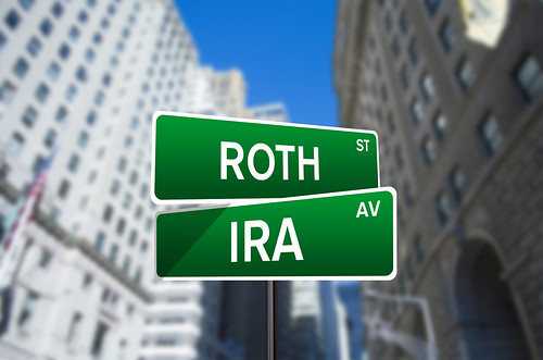 Roth IRA Street Sign On Wall Street - Roth IRA Street Sign O