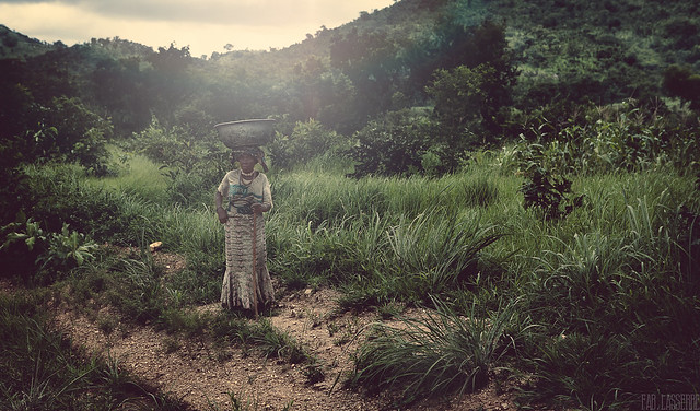 An old Woman I met along a deserted road. She was standing there as she had waited for me. She smiled after i took the picture and went away - Togo Near Benin - 2014 August