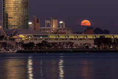 Full moon rises over the Convention Center and Petco