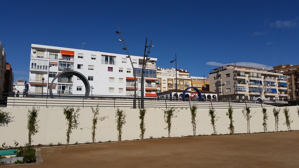 Boulevard of San Pedro Alcántara with walkways, round sculptures and surrounding buildings