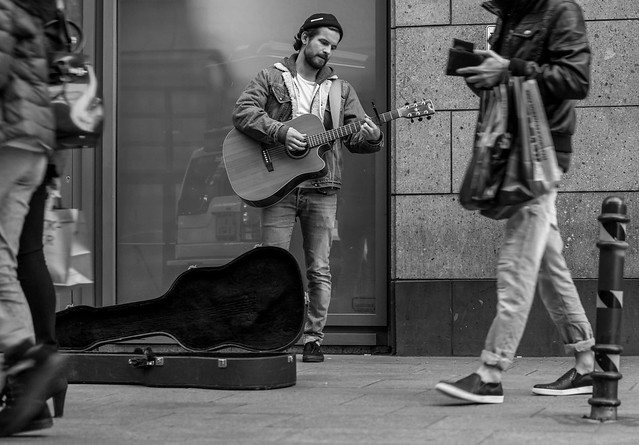 Great street musician on a busy street