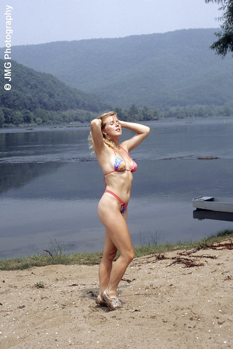 glamour standing outdoors naturallight swimsuit blonde longhair mountains river beach bikini