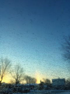 Winter sunrise, frost on window