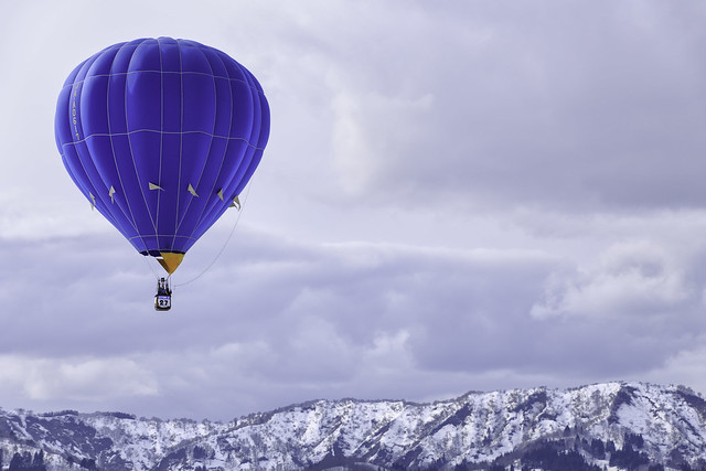 A Hot-air Balloon Flying Over the Mountains 1