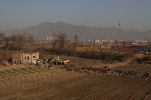 Farmland takes over from the northern suburbs of Beijing