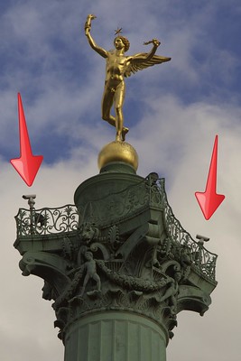 “The same figure as above with added red arrows to show the subtly located surveillance cameras”