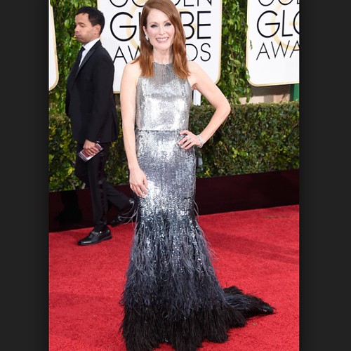Julianne Moore definitely best dressed at the Golden Globes in Givenchy couture silver ombré. The feathers at the bottom are stunning.  #JulianneMoore #GoldenGlobes #Givency #couture #silver #ombre