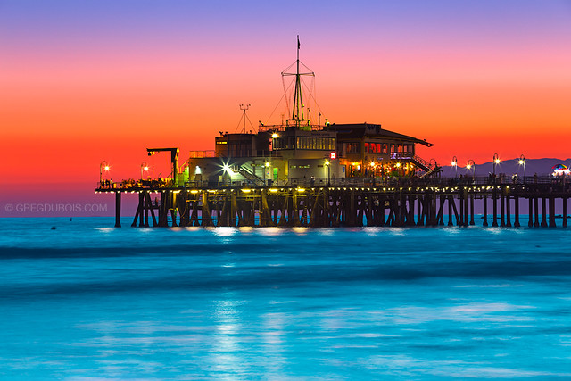 Sunset Burn over Santa Monica Pier and Pacific Ocean with Malibu Mountains - Santa Monica Beach Los Angeles County California