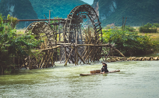 Unidentified farmers work at the bamboo raft in Caobang