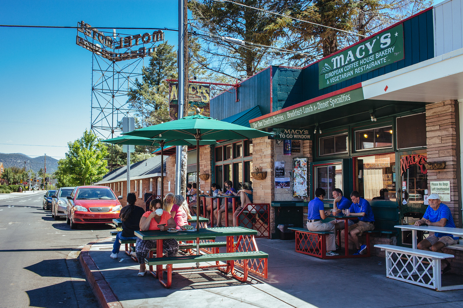 Customers sit at tables on a café patio in Flagstaff, Arizona