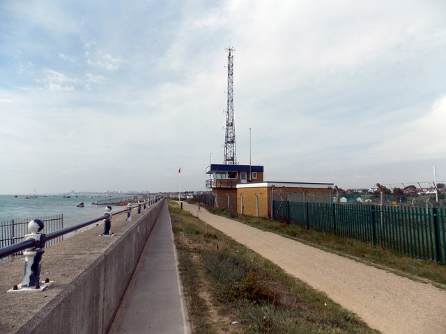 COAST GUARD CONTROL OFFICE AND RADIO TOWER WITH A PUBLIC WALK WAY ACROSS AN EX MILITARY SITE AT A SEASIDE COASTAL HOLIDAY RESORT ON THE EAST COAST ENGLAND DSCN2018