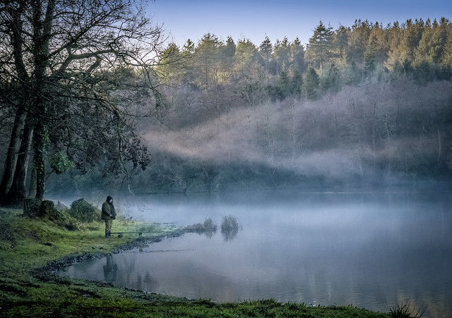 Evening mist drifts over Shearwater Lake at Crockerton in Wiltshire