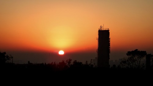 sunrise alvorada sol sun city cidade orange laranja torre tower