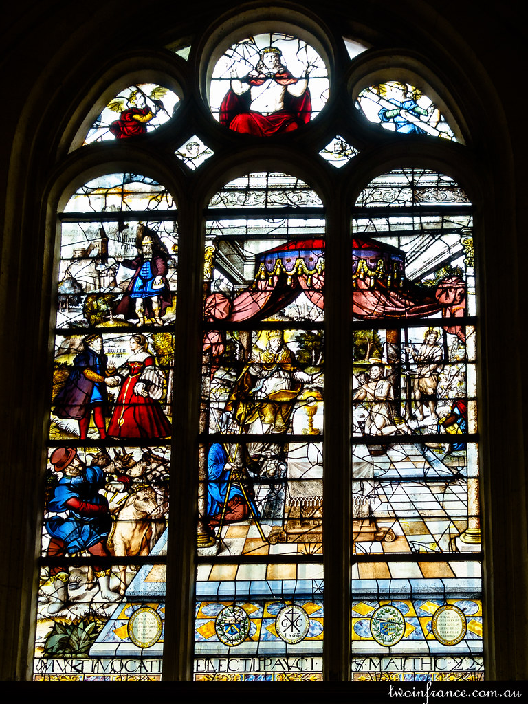 Stained glass window of  The Parable of Those Invited to the Wedding Feast.