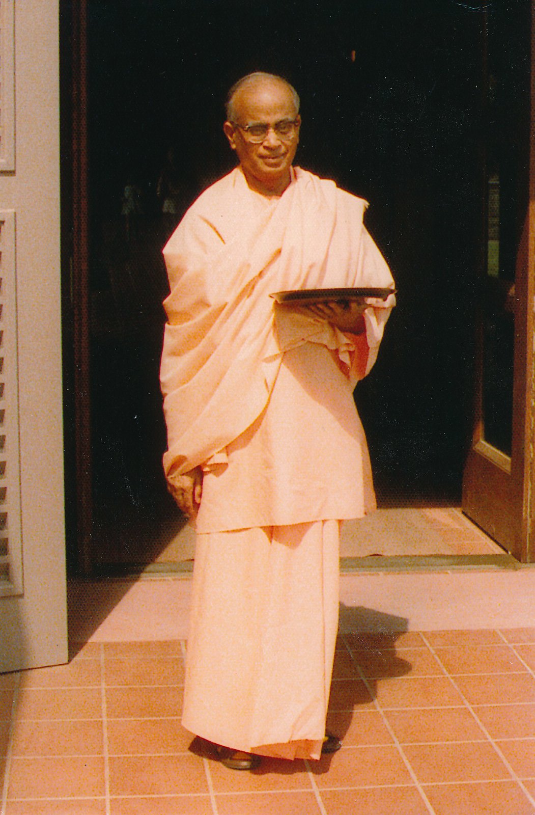 Swami Shraddhananda Swami Distributing Prasad