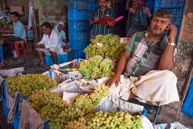 A vendor selling grapes at Mechua market in Kolkata, India.