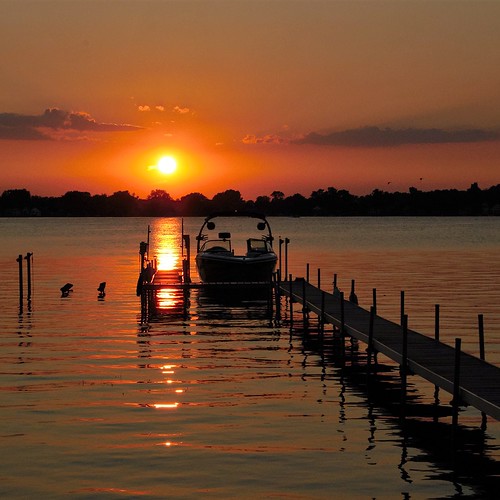 lake boat dock michigan sunset